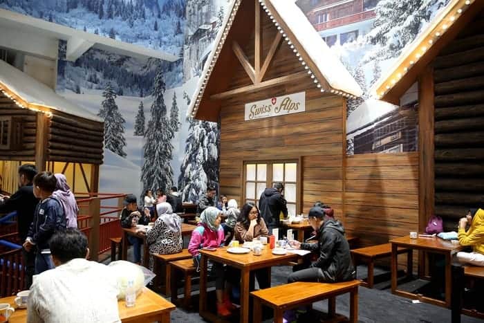 Enjoying Hot Chocolate in the Cold Swiss Alps